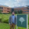 Justin Conover posing in front of the Danforth Center