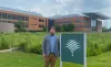 Justin Conover posing in front of the Danforth Center